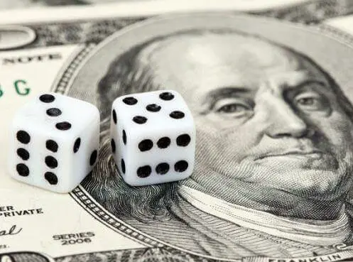 Image of a American dollar bill with dice