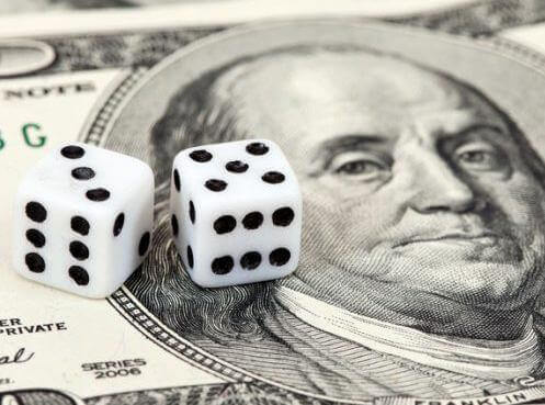 Image of a American dollar bill with dice